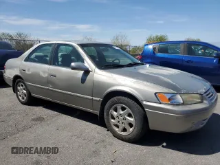 1999 Toyota Camry LE z VIN JT2BF22K4X0202019, wystawiony jako Copart lot #56104335 z przebiegiem 192 643 mil mil oraz Tytuł czysty. Historia ofert i sprzedaży dostępna na DreamBid. Obrazek 4.