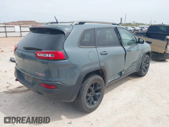2015 Jeep Cherokee Trailhawk with VIN 1C4PJMBS0FW524479, listed as a IAAI auction lot 41908871 with 118,825 mi miles and . Bid and sale history available at DreamBid. Image 4.