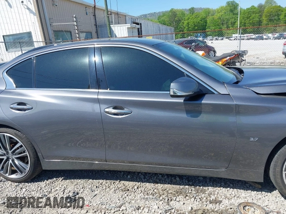2014 Infiniti Q50 Premium z VIN JN1BV7AR0EM700278, wystawiony jako IAAI lot #42043943 z przebiegiem 107 369 mil mil oraz . Historia ofert i sprzedaży dostępna na DreamBid. Obrazek 13.