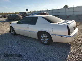 2000 Cadillac Eldorado z VIN 1G6EL12Y5YU176121, wystawiony jako Copart lot #77123914 z przebiegiem 91 663 mil mil oraz Szkoda całkowita • Salvage title. Historia ofert i sprzedaży dostępna na DreamBid. Obrazek 2.