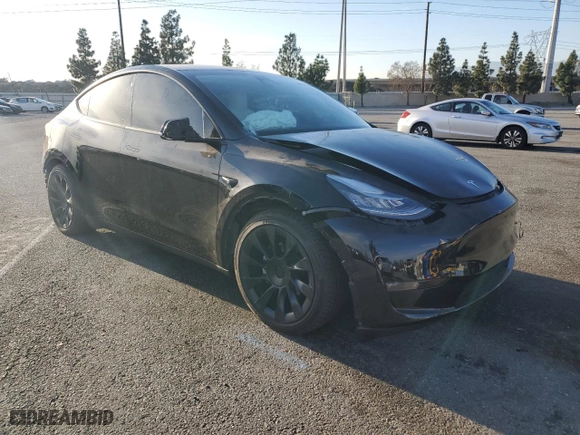 2023 Tesla Model Y Performance with VIN 7SAYGDEF6PF635595, listed as a Copart auction lot 88483825 with 0 mi miles and Salvage Title. Bid and sale history available at carsss.com. Image 4.