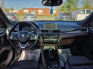 2017 BMW X1 xDrive28i with VIN WBXHT3C32H5F79305, listed as a Copart auction lot 54665865 with 113,046 mi miles and Clean Title. Bid and sale history available at carsss.com. Image 9.