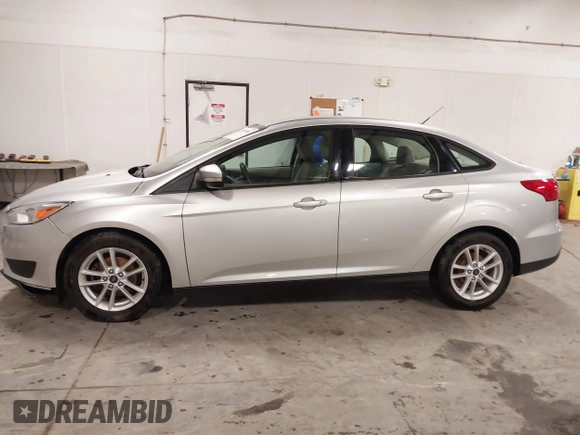 2017 Ford Focus SE z VIN 1FADP3F20HL245291, wystawiony jako IAAI lot #42194880 z przebiegiem 93 764 mil mil oraz . Historia ofert i sprzedaży dostępna na DreamBid. Obrazek 14.