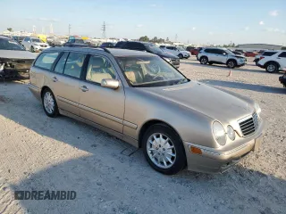 2000 Mercedes-Benz E-Class with VIN WDBJH65J4YB071699, listed as a Copart auction lot 75082144 with 105,989 mi miles and Salvage Title. Bid and sale history available at carsss.com. Image 4.