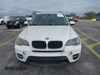 2011 BMW X5 35i with VIN 5UXZV4C54BL412770, listed as a IAAI auction lot 41618946 with 148,612 mi miles. Bid and sale history available at carsss.com. Image 6.