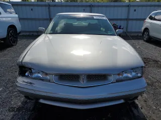 1997 Pontiac Bonneville SE z VIN 1G2HX52K7VH211607, wystawiony jako Copart lot #73705454 z przebiegiem 116 307 mil mil oraz Szkoda całkowita • Salvage title. Historia ofert i sprzedaży dostępna na DreamBid. Obrazek 5.