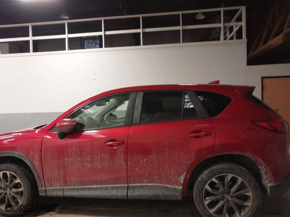 2016 Mazda CX-5 Grand Touring with VIN JM3KE4DY8G0622347, listed as a IAAI auction lot 41618997 with NaN miles. Bid and sale history available at carsss.com. Image 15.