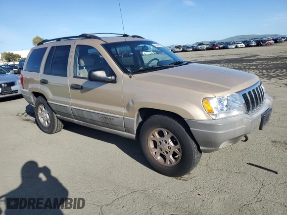 1999 Jeep Grand Cherokee Laredo z VIN 1J4GW58NXXC704719, wystawiony jako Copart lot #49546395 z przebiegiem 276 716 mil mil oraz Czysty tytuł • Clean title. Historia ofert i sprzedaży dostępna na DreamBid. Obrazek 4.