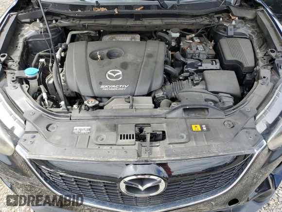 2014 Mazda CX-5 Grand Touring with VIN JM3KE4DY3E0304908, listed as a Copart auction lot 53873655 with 144,382 mi miles and Salvage Title. Bid and sale history available at DreamBid. Image 12.