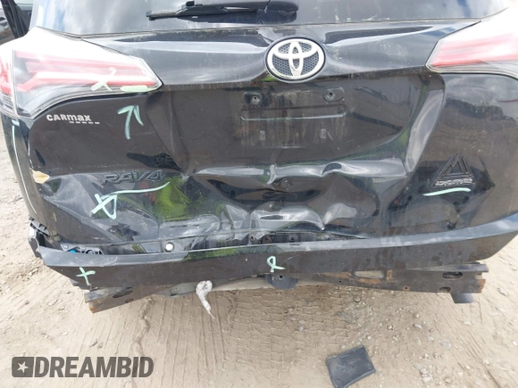 2018 Toyota RAV4 XLE with VIN 2T3RFREV1JW697044, listed as a IAAI auction lot 41891412 with 140,145 mi miles. Bid and sale history available at carsss.com. Image 6.