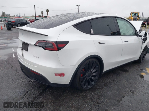 2022 Tesla Model Y Performance with VIN 7SAYGDEFXNF384268, listed as a IAAI auction lot 41558359 with 33,870 mi miles and . Bid and sale history available at DreamBid. Image 4.