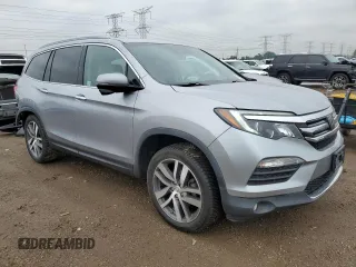2018 Honda Pilot Touring z VIN 5FNYF6H94JB039992, wystawiony jako Copart lot #57128435 z przebiegiem 85 578 mil mil oraz Szkoda całkowita • Salvage title. Historia ofert i sprzedaży dostępna na DreamBid. Obrazek 4.
