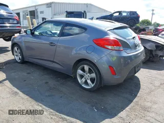 2013 Hyundai Veloster w/Gray Int with VIN KMHTC6ADXDU172104, listed as a IAAI auction lot 42198689 with 67,160 mi miles and . Bid and sale history available at DreamBid. Image 3.