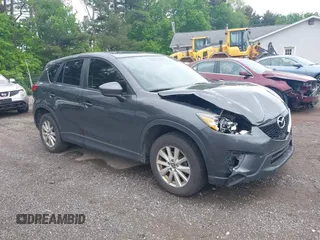 2014 Mazda CX-5 Sport z VIN JM3KE4BE9E0365253, wystawiony jako IAAI lot #42234876 z przebiegiem 154 976 mil mil oraz . Historia ofert i sprzedaży dostępna na DreamBid. Obrazek 1.
