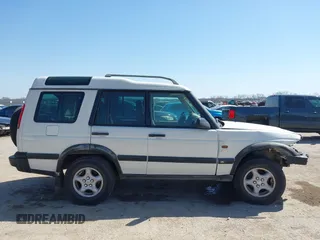 2000 Land Rover Discovery Cloth z VIN SALTY124XYA262828, wystawiony jako IAAI lot #41769729 z przebiegiem 215 711 mil mil oraz . Historia ofert i sprzedaży dostępna na DreamBid. Obrazek 14.