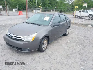 2009 Ford Focus SE with VIN 1FAHP35N49W178711, listed as a IAAI auction lot 42084721 with 203,889 mi miles. Bid and sale history available at carsss.com. Image 2.