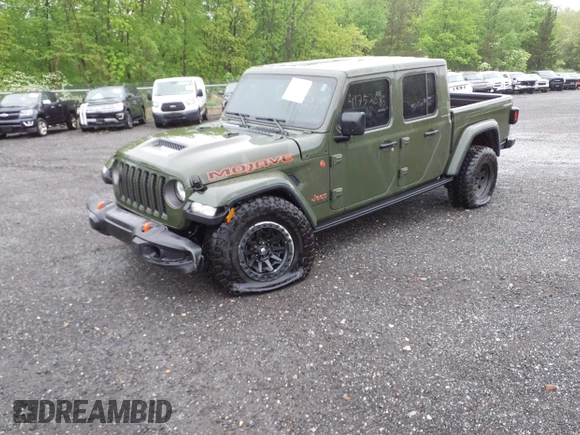 2023 Jeep Gladiator Mojave with VIN 1C6JJTEG6PL564504, listed as a IAAI auction lot 41752685 with 20,430 mi miles and . Bid and sale history available at DreamBid. Image 2.
