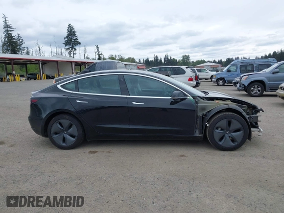 2019 Tesla Model 3 Mid Range with VIN 5YJ3E1EA6KF415656, listed as a IAAI auction lot 42140763 with 71,408 mi miles and . Bid and sale history available at carsss.com. Image 14.