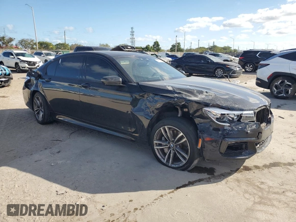 2017 BMW 7 Series 740i with VIN WBA7E2C51HG739462, listed as a Copart auction lot 84157364 with 137,881 mi miles and Salvage Title. Bid and sale history available at carsss.com. Image 4.