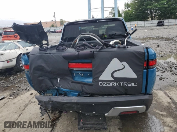 2023 Rivian R1T Adventure with VIN 7FCTGBAA5PN026063, listed as a Copart auction lot 66916194 with Not Provided miles and Salvage Title. Bid and sale history available at DreamBid. Image 6.