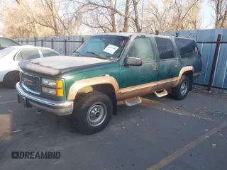 1997 GMC Suburban z VIN 1GKGK26J6VJ758001, wystawiony jako IAAI lot #41457050 z przebiegiem 164 337 mil mil oraz . Historia ofert i sprzedaży dostępna na DreamBid. Obrazek 2.