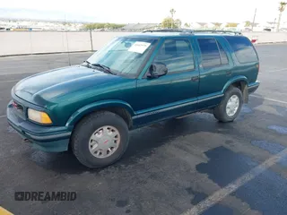1997 GMC Jimmy SLS with VIN 1GKDT13W7V2516192, listed as a IAAI auction lot 41442979 with 154,518 mi miles. Bid and sale history available at carsss.com. Image 2.