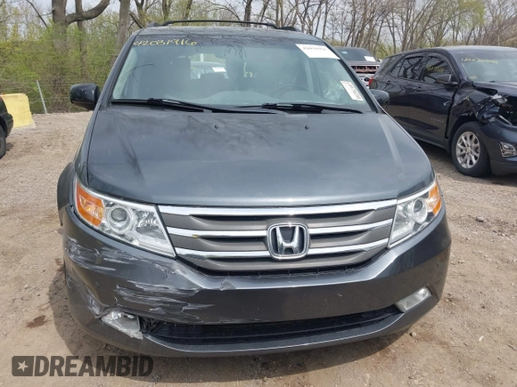 2012 Honda Odyssey Touring with VIN 5FNRL5H99CB028304, listed as a IAAI auction lot 42031916 with 216,185 mi miles and . Bid and sale history available at DreamBid. Image 13.