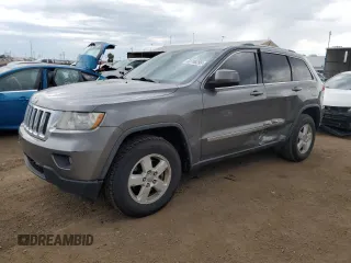 2011 Jeep Grand Cherokee Laredo z VIN 1J4RR4GG1BC734682, wystawiony jako Copart lot #60708395 z przebiegiem 188 670 mil mil oraz Szkoda całkowita • Salvage title. Historia ofert i sprzedaży dostępna na DreamBid. Obrazek 1.