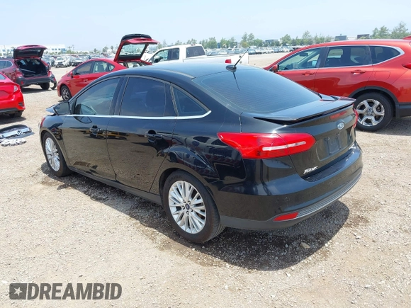 2016 Ford Focus Titanium z VIN 1FADP3J20GL310467, wystawiony jako IAAI lot #42478332 z przebiegiem 214 479 mil mil oraz . Historia ofert i sprzedaży dostępna na DreamBid. Obrazek 3.