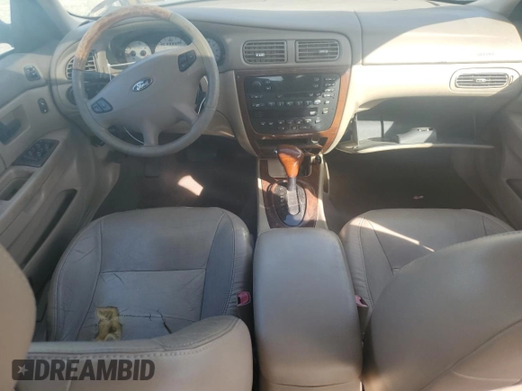 2003 Ford Taurus SEL Deluxe with VIN 1FAFP56S23G221922, listed as a Copart auction lot 79673294 with 142,911 mi miles and Salvage Title. Bid and sale history available at DreamBid. Image 8.