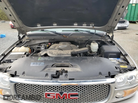 2005 GMC Yukon Denali z VIN 1GKEK63U65J262371, wystawiony jako Copart lot #52773425 z przebiegiem 129 028 mil mil oraz Czysty tytuł • Clean title. Historia ofert i sprzedaży dostępna na DreamBid. Obrazek 12.