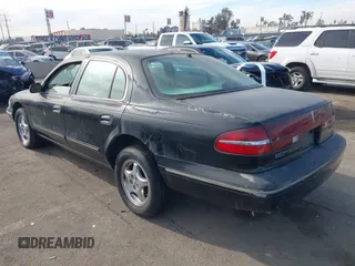 1997 Lincoln Continental with VIN 1LNLM97V5VY665410, listed as a IAAI auction lot 41239128 with 66,873 mi miles. Bid and sale history available at carsss.com. Image 3.