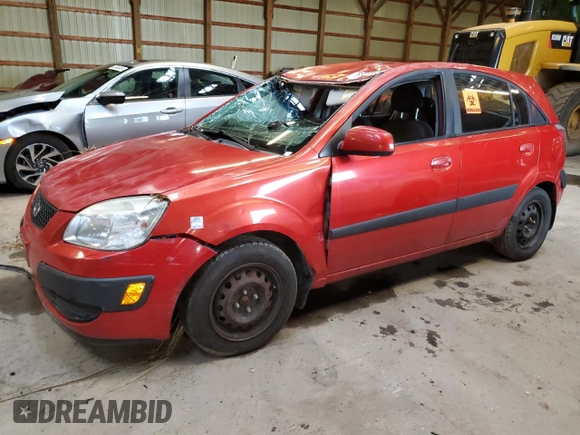 2009 Kia Rio LX with VIN KNADE243696572877, listed as a Copart auction lot 66075394 with 0 mi miles and Non Repairable. Bid and sale history available at carsss.com. Image 1.