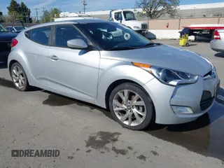 2017 Hyundai Veloster with VIN KMHTC6AD4HU304795, listed as a IAAI auction lot 41978650 with 106,781 mi miles. Bid and sale history available at carsss.com. Image 1.