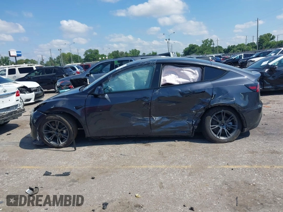 2024 Tesla Model Y with VIN 7SAYGDED9RA321373, listed as a IAAI auction lot 42228491 with 6,452 mi miles and . Bid and sale history available at DreamBid. Image 13.