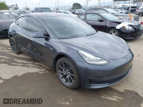 2018 Tesla Model 3 Long Range Battery with VIN 5YJ3E1EA0JF101564, listed as a IAAI auction lot 41902214 with 101,581 mi miles. Bid and sale history available at carsss.com. Image 1.