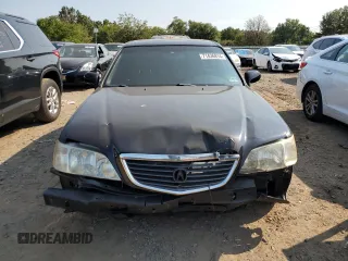 2002 Acura RL with VIN JH4KA96512C013028, listed as a Copart auction lot 71436914 with 142,527 mi miles and Salvage Title. Bid and sale history available at carsss.com. Image 5.