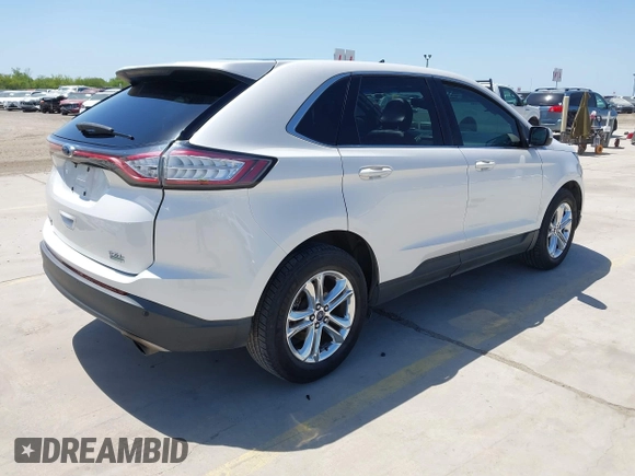2015 Ford Edge SEL with VIN 2FMTK3J97FBC16209, listed as a IAAI auction lot 41974393 with 129,608 mi miles. Bid and sale history available at carsss.com. Image 4.