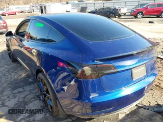 2023 Tesla Model 3 Long Range with VIN 5YJ3E1EB0PF688172, listed as a IAAI auction lot 41411580 with 21,125 mi miles and . Bid and sale history available at DreamBid. Image 3.