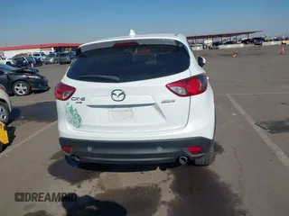 2014 Mazda CX-5 Grand Touring with VIN JM3KE4DY4E0375809, listed as a IAAI auction lot 41468078 with 151,226 mi miles. Bid and sale history available at carsss.com. Image 16.