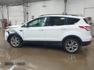 2014 Ford Escape SE with VIN 1FMCU9G99EUC15477, listed as a IAAI auction lot 42147162 with 98,886 mi miles and . Bid and sale history available at DreamBid. Image 14.