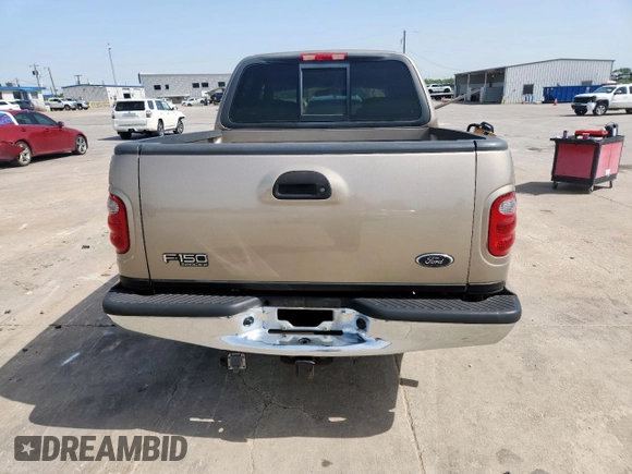 2001 Ford F-150 XLT z VIN 1FTRW07L01KB30498, wystawiony jako Copart lot #57157585 z przebiegiem 343 041 mil mil oraz Szkoda całkowita • Salvage title. Historia ofert i sprzedaży dostępna na DreamBid. Obrazek 6.