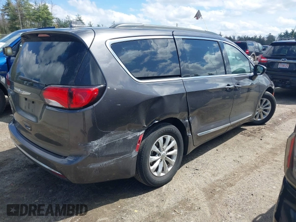 2017 Chrysler Pacifica Touring L with VIN 2C4RC1BGXHR667397, listed as a IAAI auction lot 42085117 with 63,996 mi miles and . Bid and sale history available at DreamBid. Image 4.