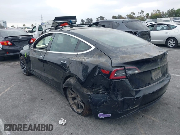 2019 Tesla Model 3 Mid Range with VIN 5YJ3E1EA2KF362048, listed as a IAAI auction lot 40141734 with 70,321 mi miles and . Bid and sale history available at carsss.com. Image 3.