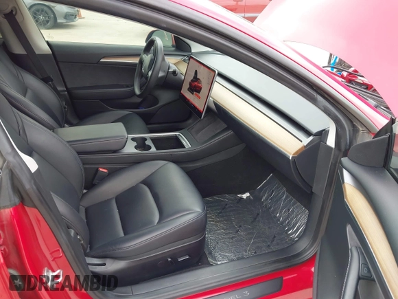 2023 Tesla Model 3 with VIN 5YJ3E1EA0PF455058, listed as a IAAI auction lot 42201618 with 31,147 mi miles and . Bid and sale history available at DreamBid. Image 5.