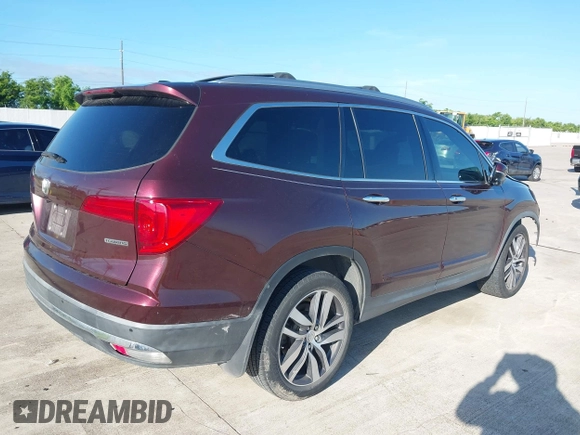 2017 Honda Pilot Touring with VIN 5FNYF5H96HB038413, listed as a IAAI auction lot 42594065 with 130,501 mi miles and . Bid and sale history available at DreamBid. Image 4.