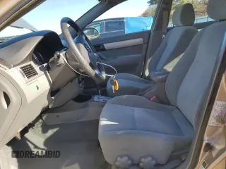 2004 Suzuki Forenza S z VIN KL5JD52Z54K991570, wystawiony jako Copart lot #49380694 z przebiegiem 98 943 mil mil oraz Szkody całkowita. Historia ofert i sprzedaży dostępna na DreamBid. Obrazek 7.