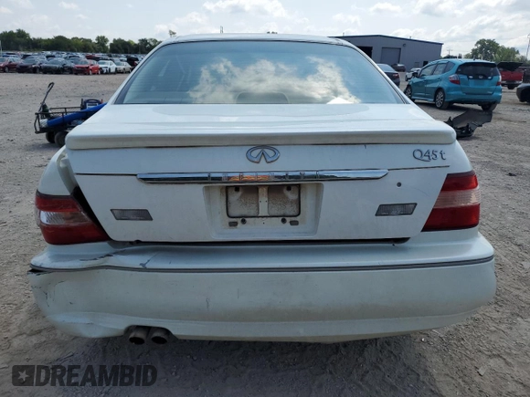1999 Infiniti Q45 z VIN JNKBY31A2XM603477, wystawiony jako Copart lot #64216924 z przebiegiem 278 602 mil mil oraz Szkody całkowita. Historia ofert i sprzedaży dostępna na DreamBid. Obrazek 6.