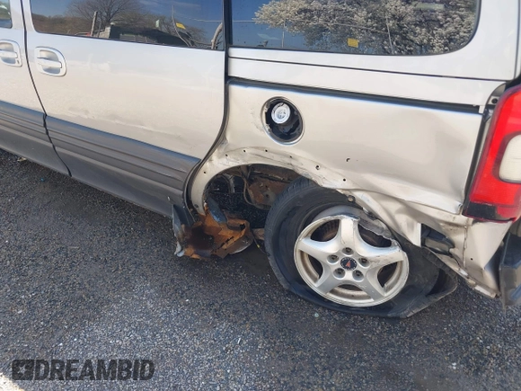 2004 Pontiac Montana z VIN 1GMDU03E94D189934, wystawiony jako IAAI lot #41968925 z przebiegiem 143 411 mil mil oraz . Historia ofert i sprzedaży dostępna na DreamBid. Obrazek 20.