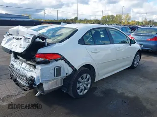2023 Toyota Corolla Hybrid LE with VIN JTDBCMFEXP3017214, listed as a IAAI auction lot 40590468 with 9,428 mi miles and . Bid and sale history available at carsss.com. Image 4.